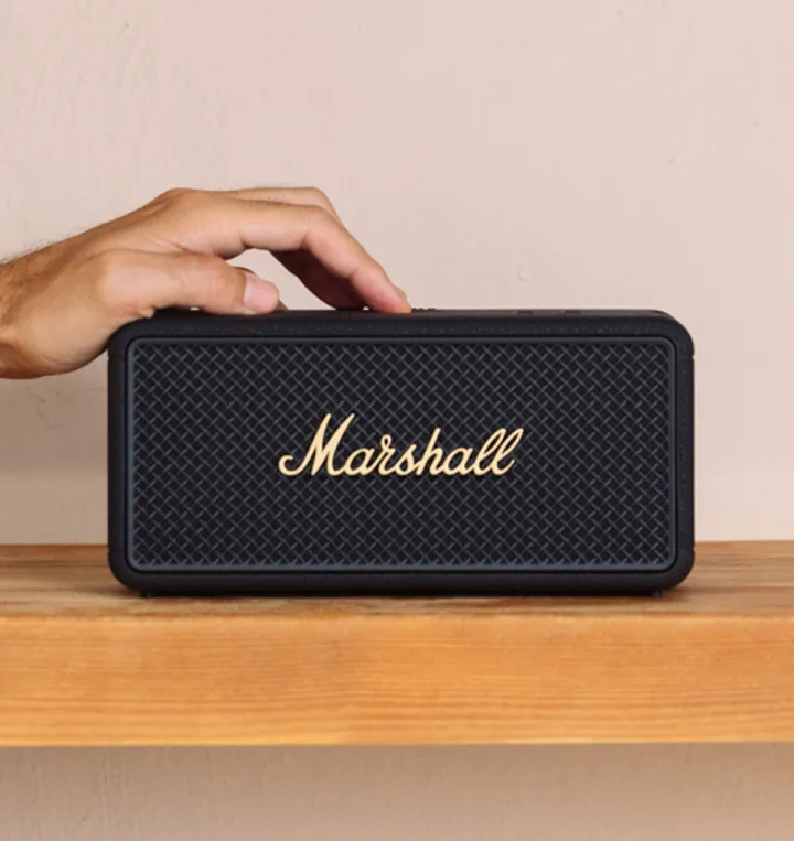 Bluetooth speaker on a wooden shelf