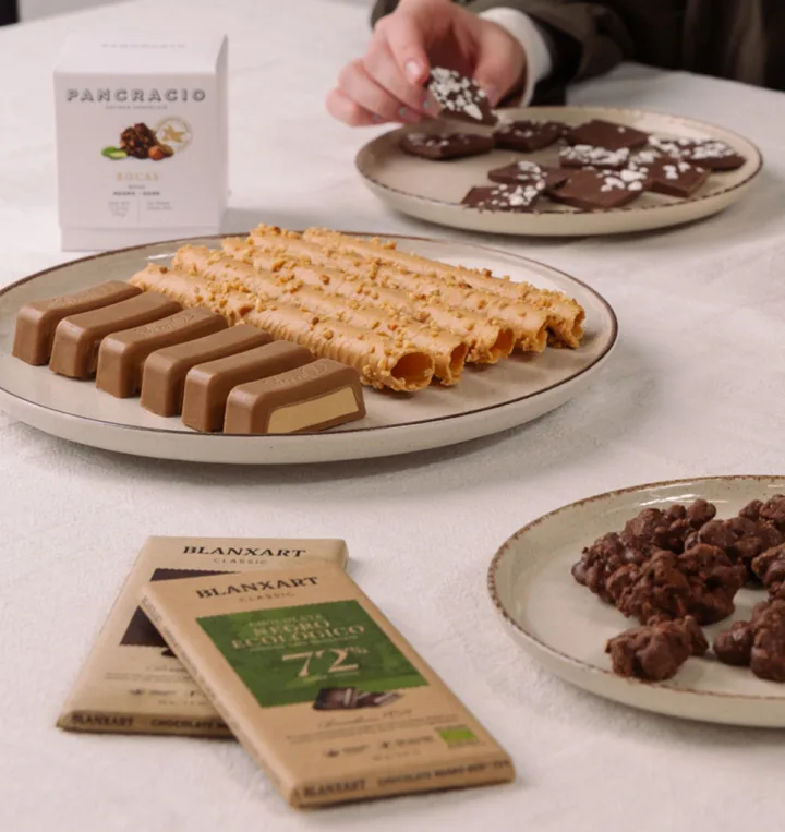 Artisan turrón and chocolates on a white tablecloth